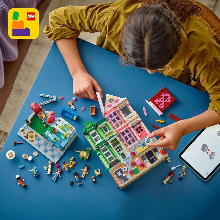 LEGO Friends Heartlake City Living and Shopping Street, set de construcție pentru jocuri de rol cu 9 personaje (inclusiv 7 minifigurine) și 3 pisici, cadou pentru fete și adolescenți, casă de jucării 42670 Seturi de constructie Besuche den LEGO-Store