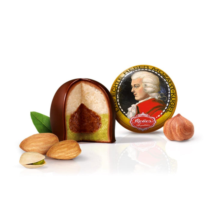 Reber Mozart, sfere din ciocolată neagră, umplute cu marțipan, fistic, migdale și nuga de alune Naty Shop